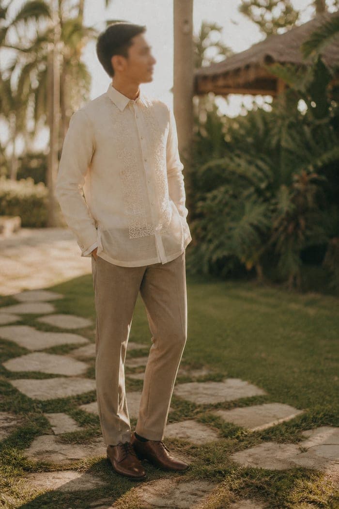 Guest in a cream piña barong tagalog and taupe trousers