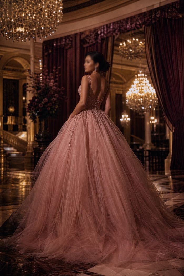 Guest in a blush satin gown in a hotel ballroom