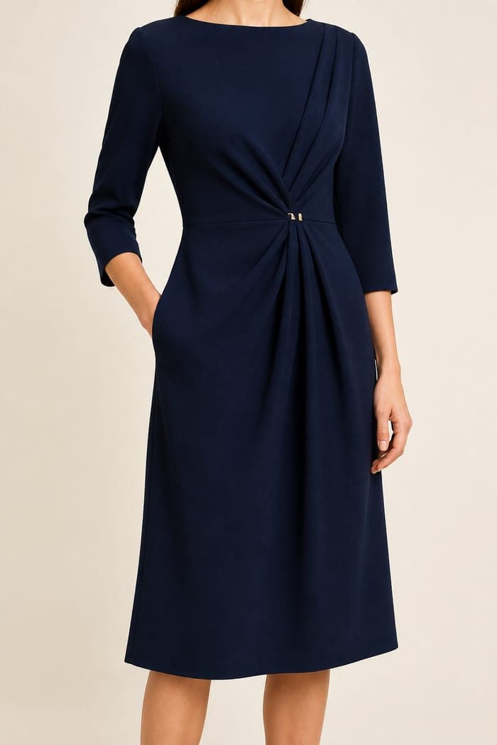 A navy suit on a dress form