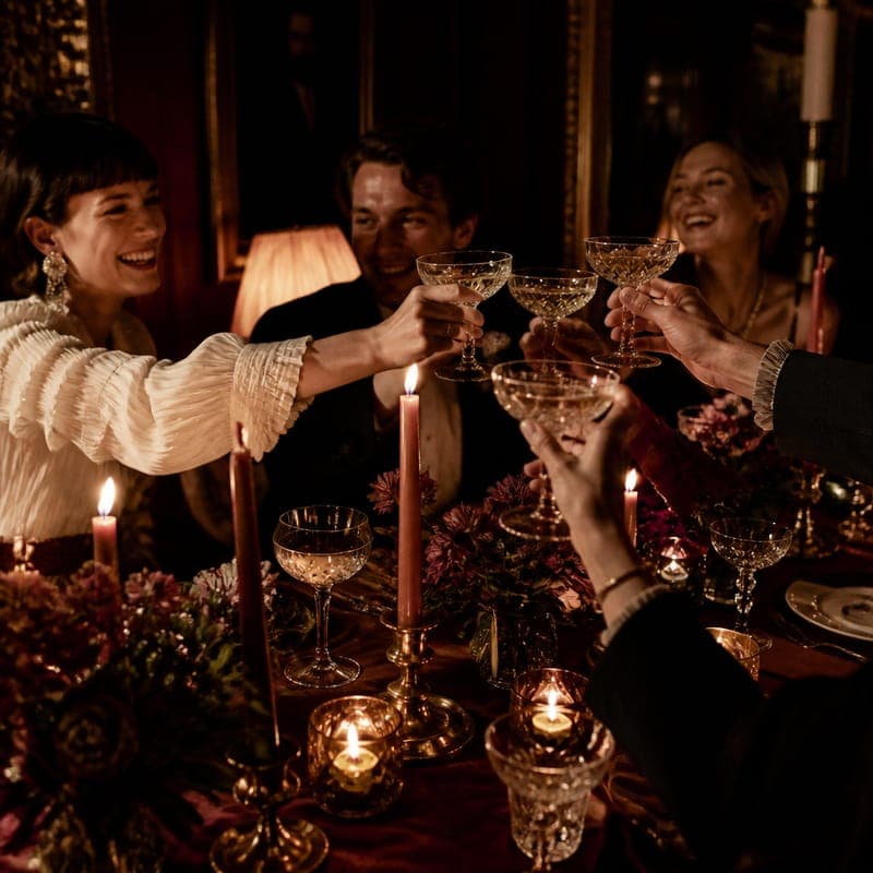 Glasses raised at the long table